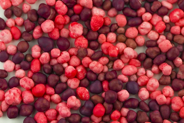 Dolci caramelle rosa e viola diffusione decorazione pasticceria backgr — Foto Stock