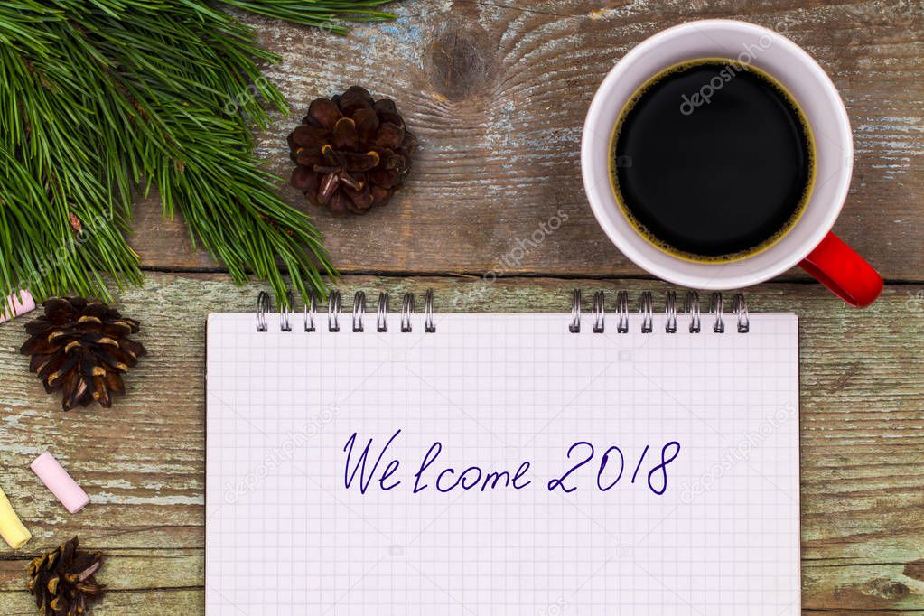 New Year 2018 concept. notebook on wood table writing Welcome 20