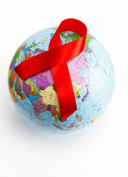 closeup a world globe with a red ribbon for the fight against AI