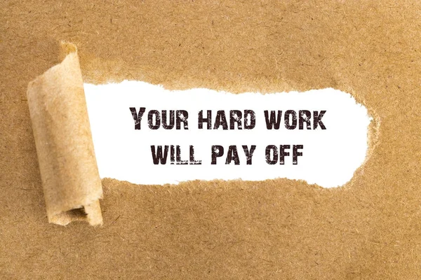 The text Your hard work will pay off appearing behind torn brown — Stock Photo, Image