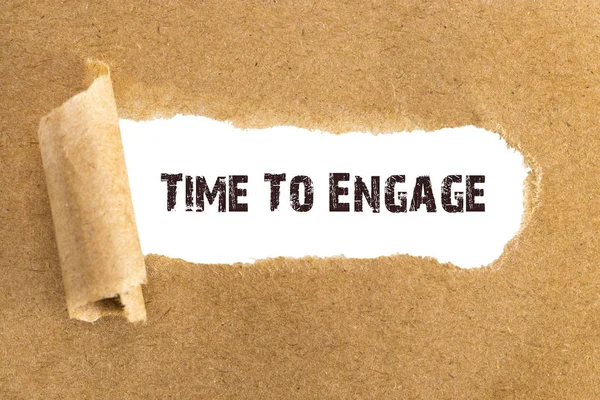The text Time To Engage appearing behind torn brown paper — Stock Photo, Image