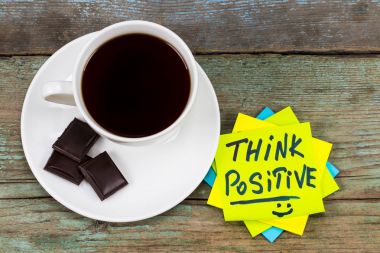 think positive - inspirational handwriting in a green sticky not clipart