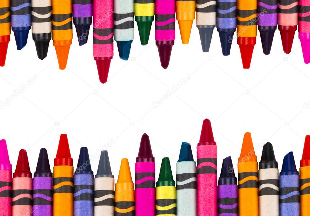 Crayons space background lined up isolated on white background w