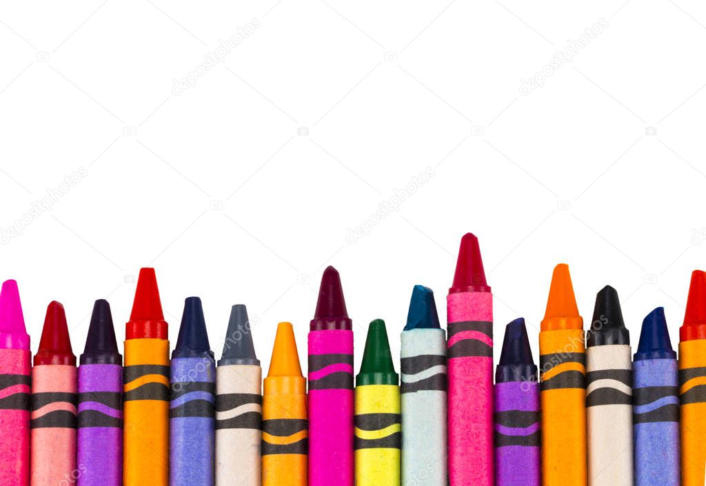 Crayons space background lined up isolated on white background w