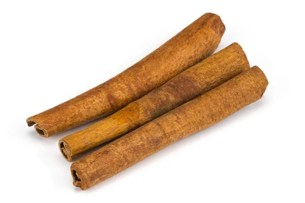 Cinnamon sticks isolated on white background. Top view — Stock Photo, Image