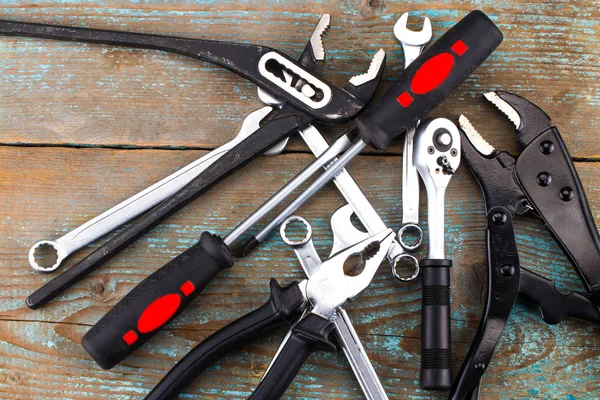 Set of tools over a wooden background — Stock Photo, Image