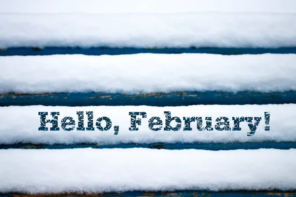 Text Hello February on old wood texture with snow — Stock Photo, Image