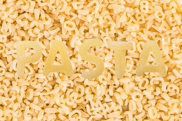 Macarrones italianos Pasta fondo de alimentos crudos o textura de cerca — Foto de Stock