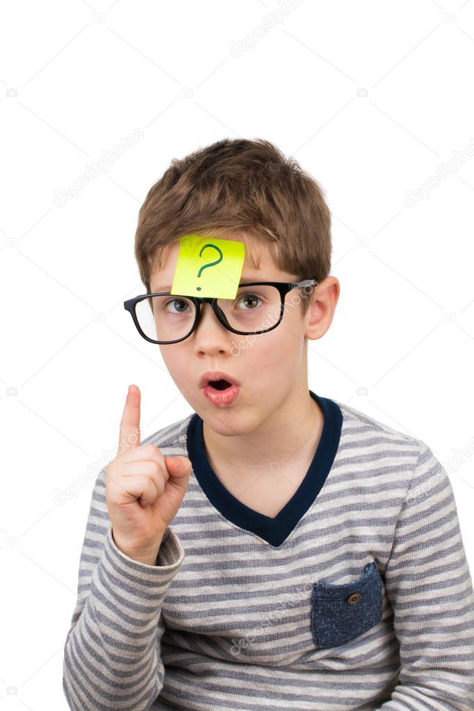 Confused boy thinking with question mark on sticky note on foreh