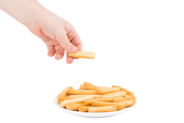 Hand holding plate of crispy bread sticks on white background. B — Stock Photo, Image