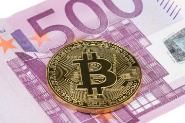 Euro para birimi zemin üzerine altın Bitcoin yakın çekim.