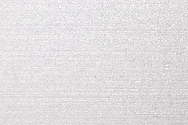 白いポリスチレンフォーム、発泡スチロールの質感の背景、クローズアップ — ストック写真
