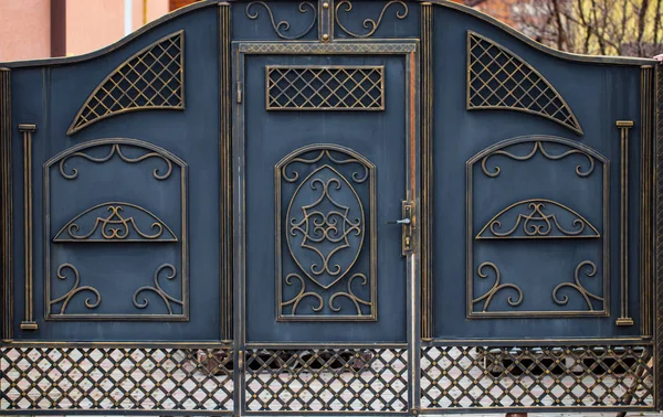 wrought-iron gates, ornamental forging, forged elements close-u