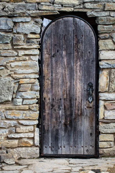 Close up of old wooden door with metal decoration — Stock Photo, Image