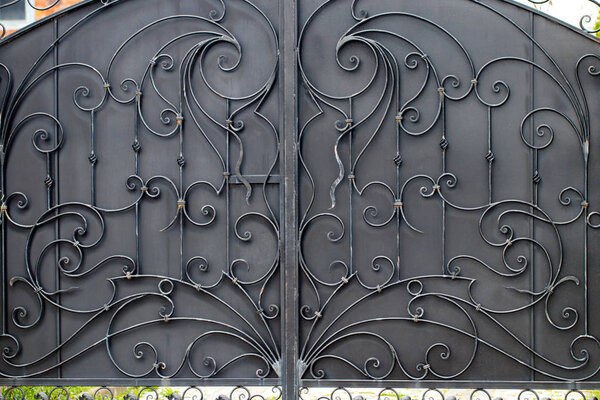 wrought-iron gates, ornamental forging, forged elements close-up