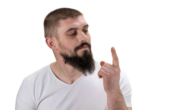 Homem olhando para seu dedo indicador no fundo branco com cópia sp — Fotografia de Stock