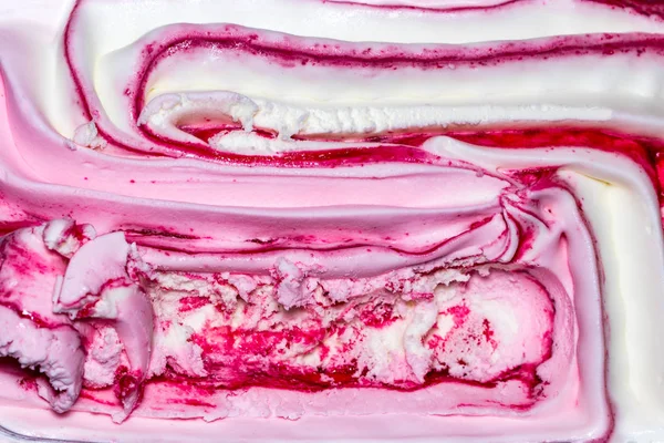 Background texture of swirling pink Italian ice cream with a rid — Stock Photo, Image