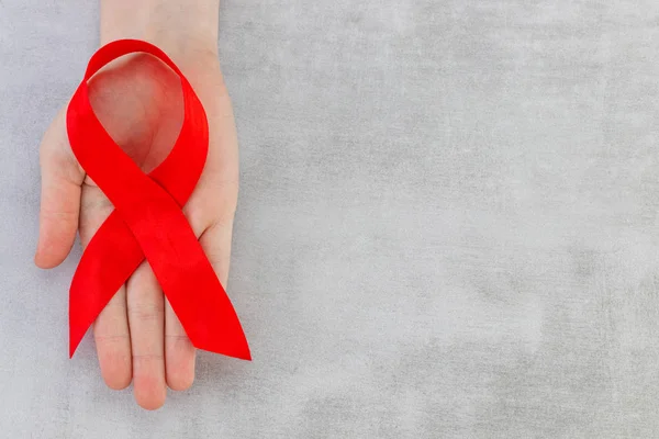 Red Ribbon - AIDS awareness symbol on the  gray background with — Φωτογραφία Αρχείου