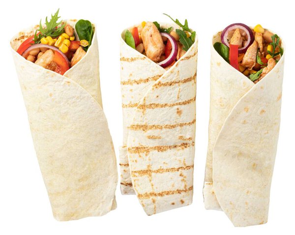 Tortilla wrap with fried chicken meat and vegetables isolated on