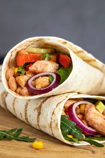 Burritos wraps with chicken and vegetables on dark background. M — Stock Photo, Image