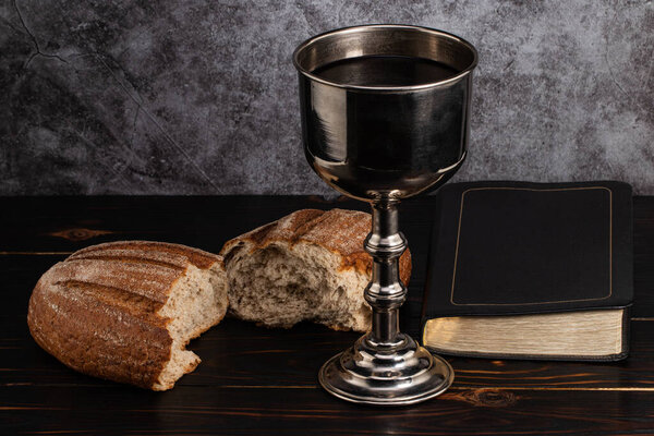 holy communion chalice with wine and bread.