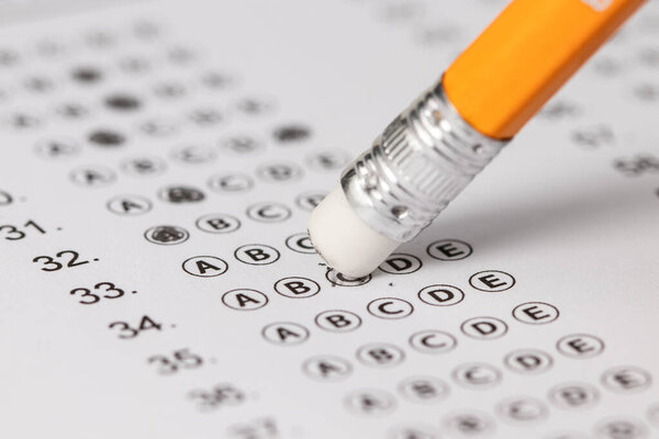 written mistake on a piece of paper, delete, correct, and mistake concept. Take the exam, write the exam.