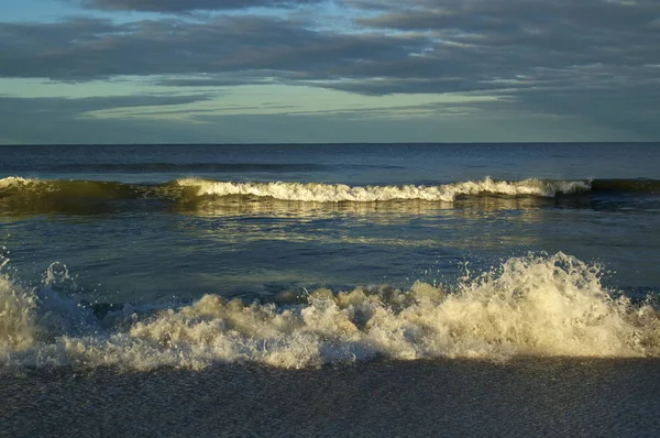 breaking waves at sunrise gulf of mexico