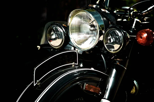 Front end of vintage black motorcycle — ストック写真