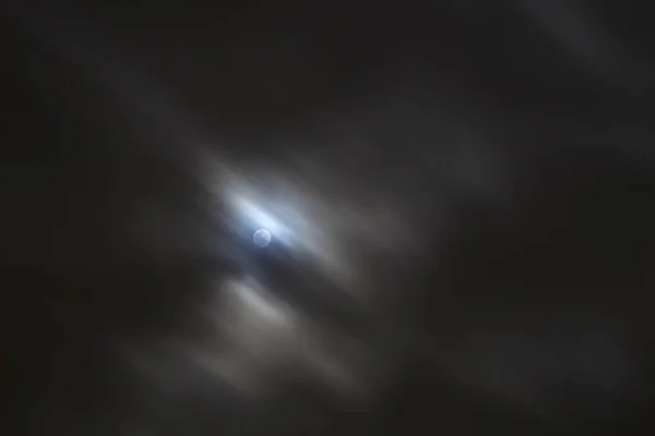 Bright moonlight from full moon with fast moving clouds — Stock Photo, Image