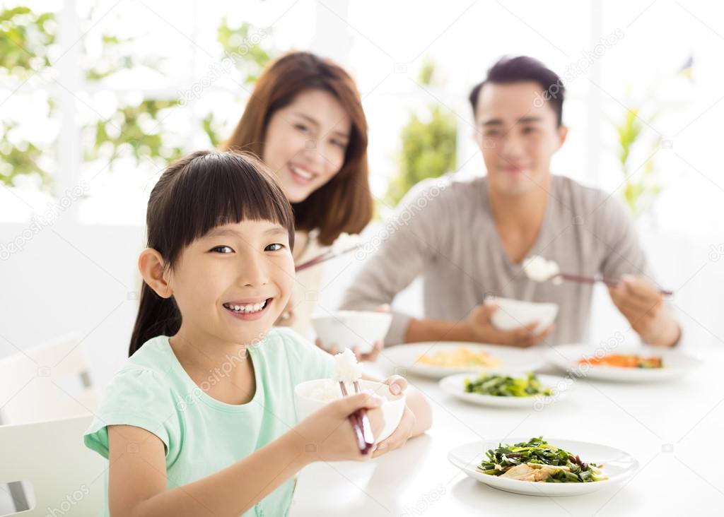 happy young Family enjoy their  dinner