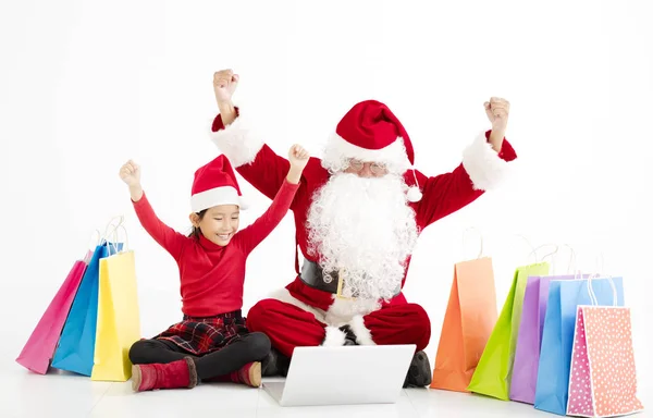 快乐的圣诞老人和圣诞网上购物的孩子 — 图库照片