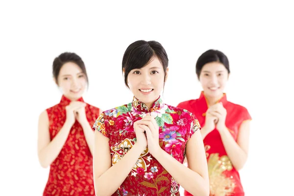 Счастливая китайская новая женщина с поздравительным жестом — стоковое фото