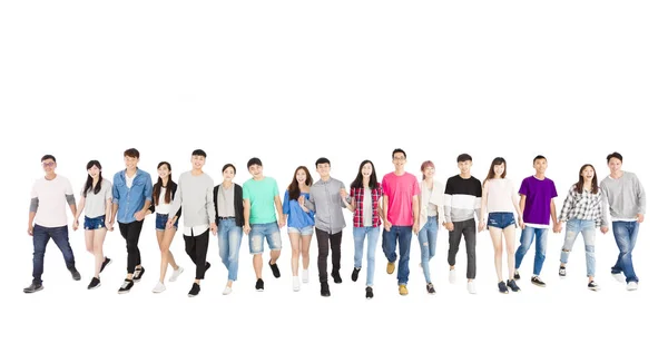 Happy young group of people walking forward together — Stock Photo, Image