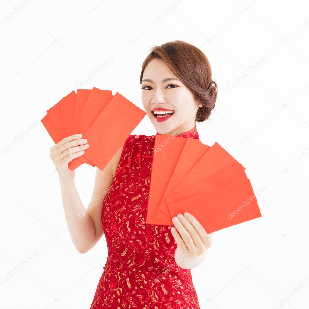 happy woman wear cheongsam and showing Red envelopes
