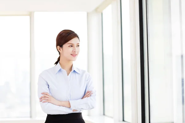 Young smiling business woman in the office — Stock Photo, Image