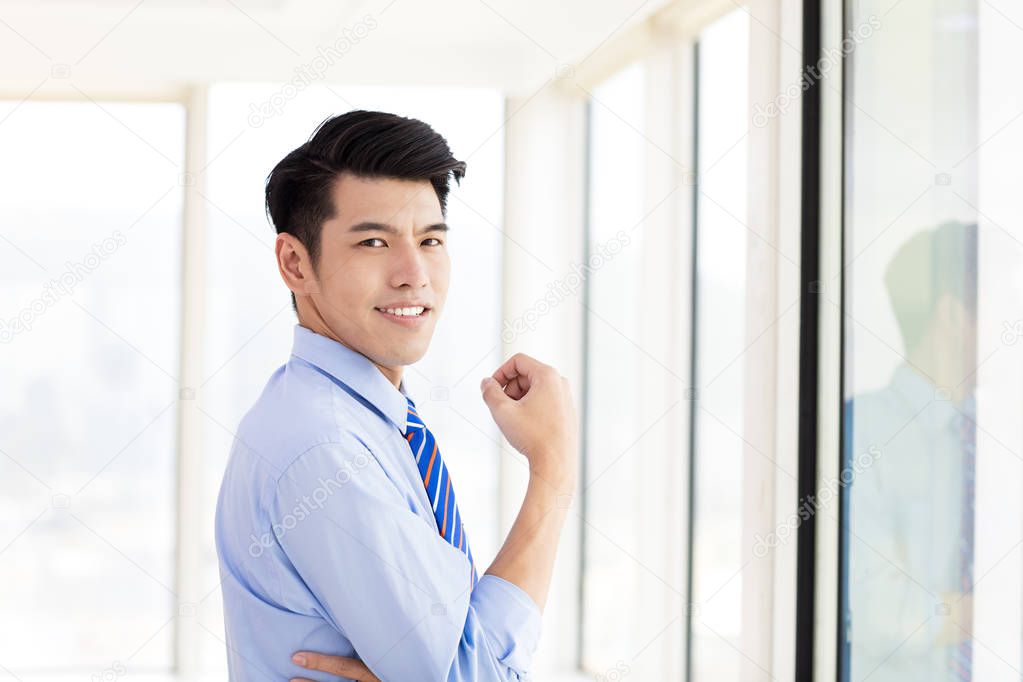 young Business man standing  in office 