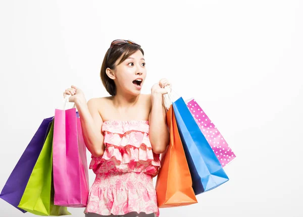 Young happy smiling woman with shopping bags — Stock Photo, Image
