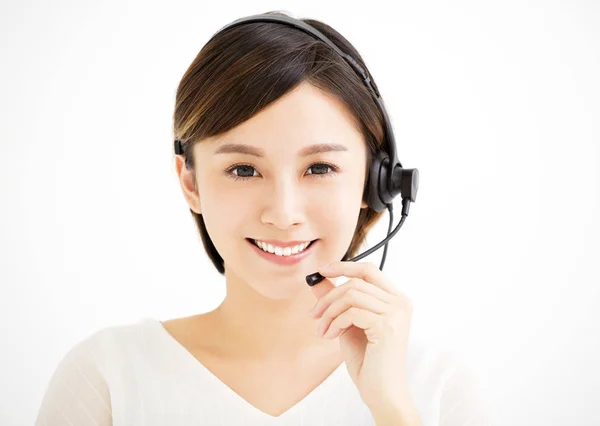 Lachende jonge zakenvrouw met headsets — Stockfoto