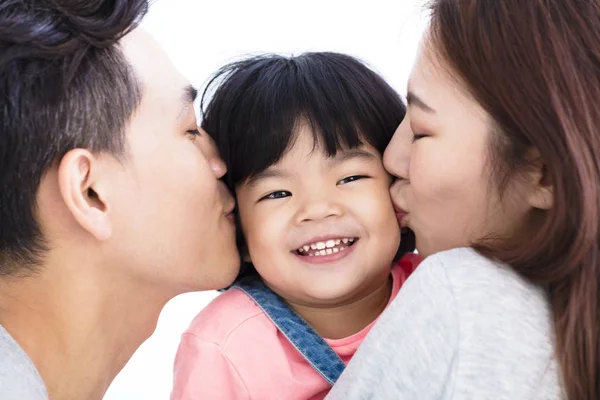 Happy asian parents kissing little gir — Stock Photo, Image