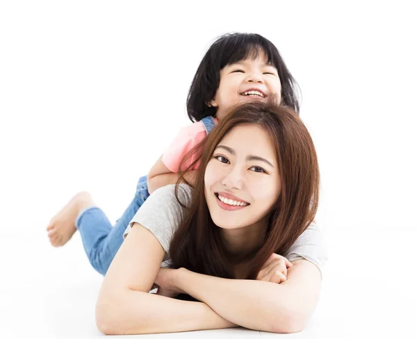 Happy mother with little girl playing on the floor — Stock Photo, Image