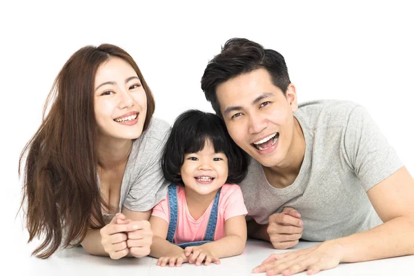 Familia feliz con la niña jugando en el suelo —  Fotos de Stock