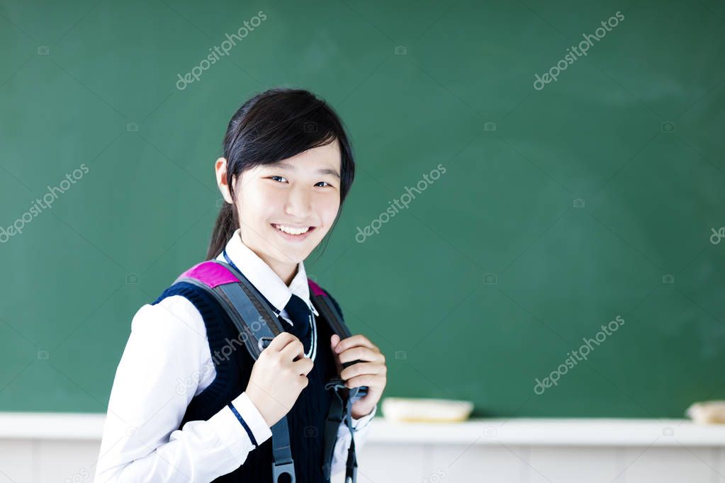smiling  teenager student girl in  classroom