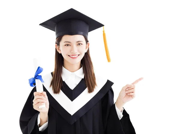 Estudiante graduado con gesto de apuntar aislado en blanco — Foto de Stock