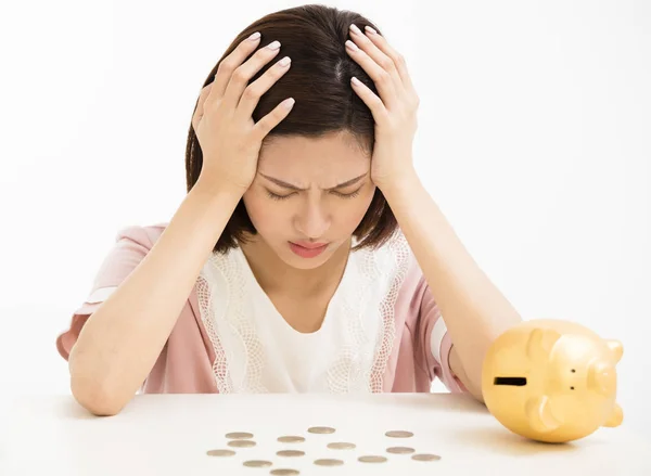 Stress young woman with piggy bank — Stock Photo, Image