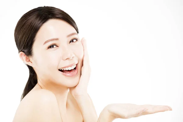 Happy  woman showing  beauty product on  hand — Stock Photo, Image