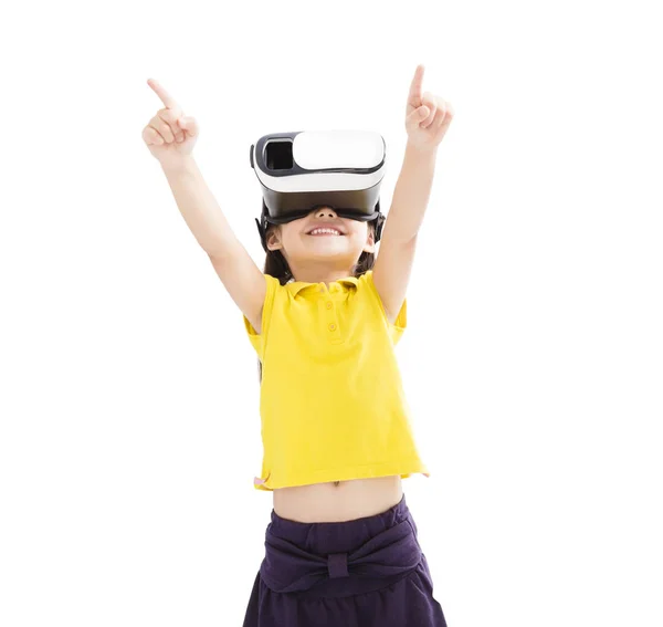 Amazed little girl looking in  VR goggles — Stock Photo, Image