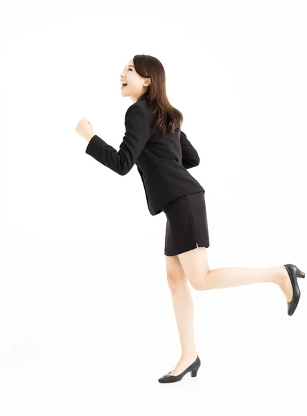 Щаслива бізнес-леді біжить і дивиться вгору — стокове фото