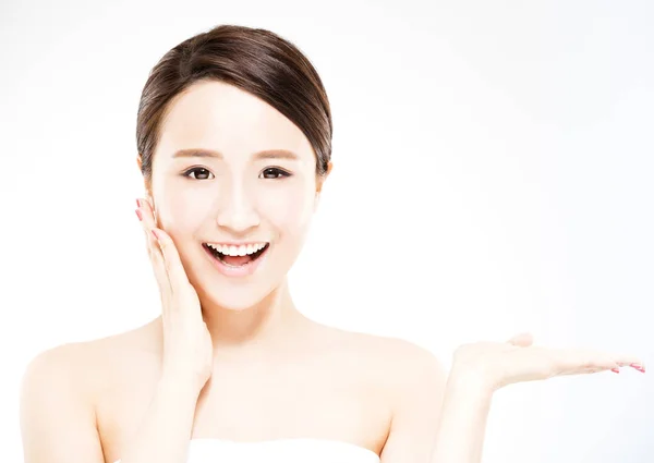 Young woman showing  beauty product on hand — Stock Photo, Image