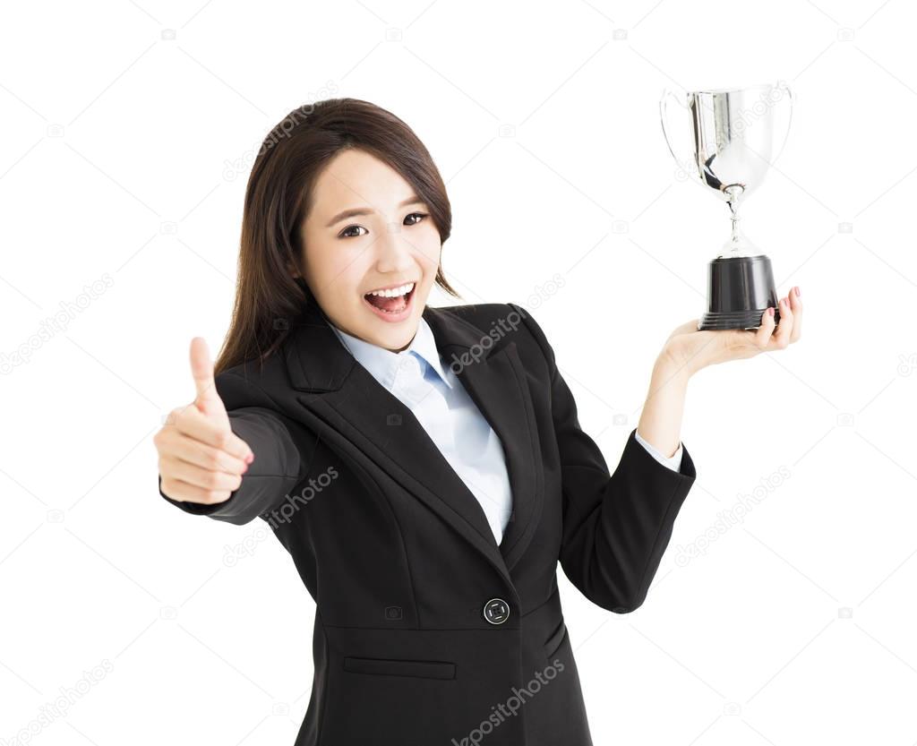 happy Businesswoman showing trophy and thumb up