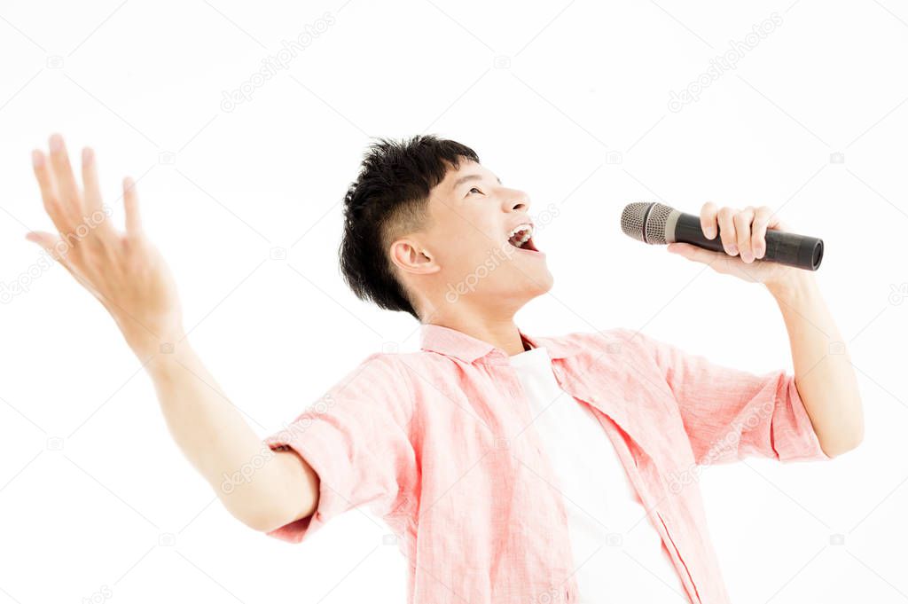 young man singing to the microphone